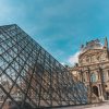 View of the Louvre Museum entrance with the baroque building on the background